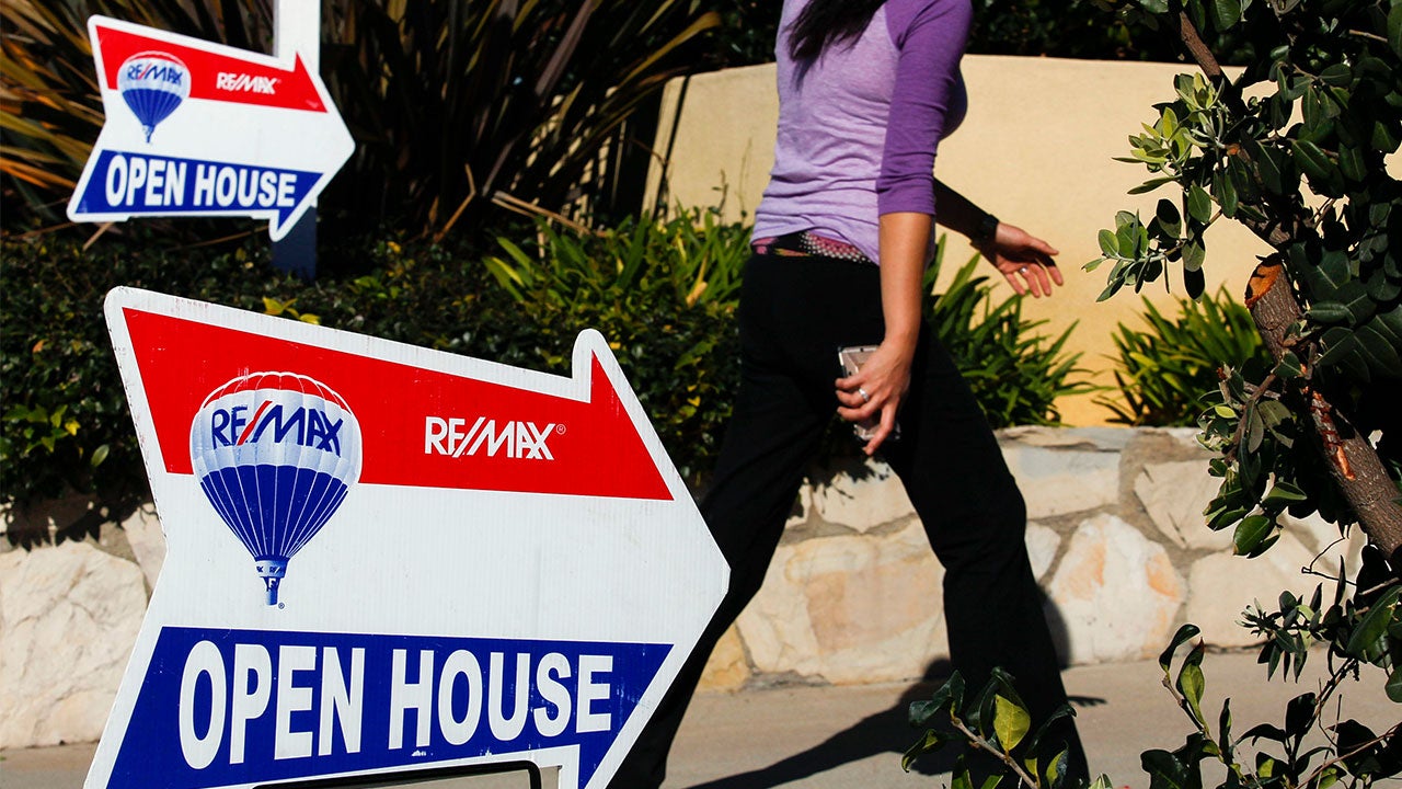 Woman walking into open house
